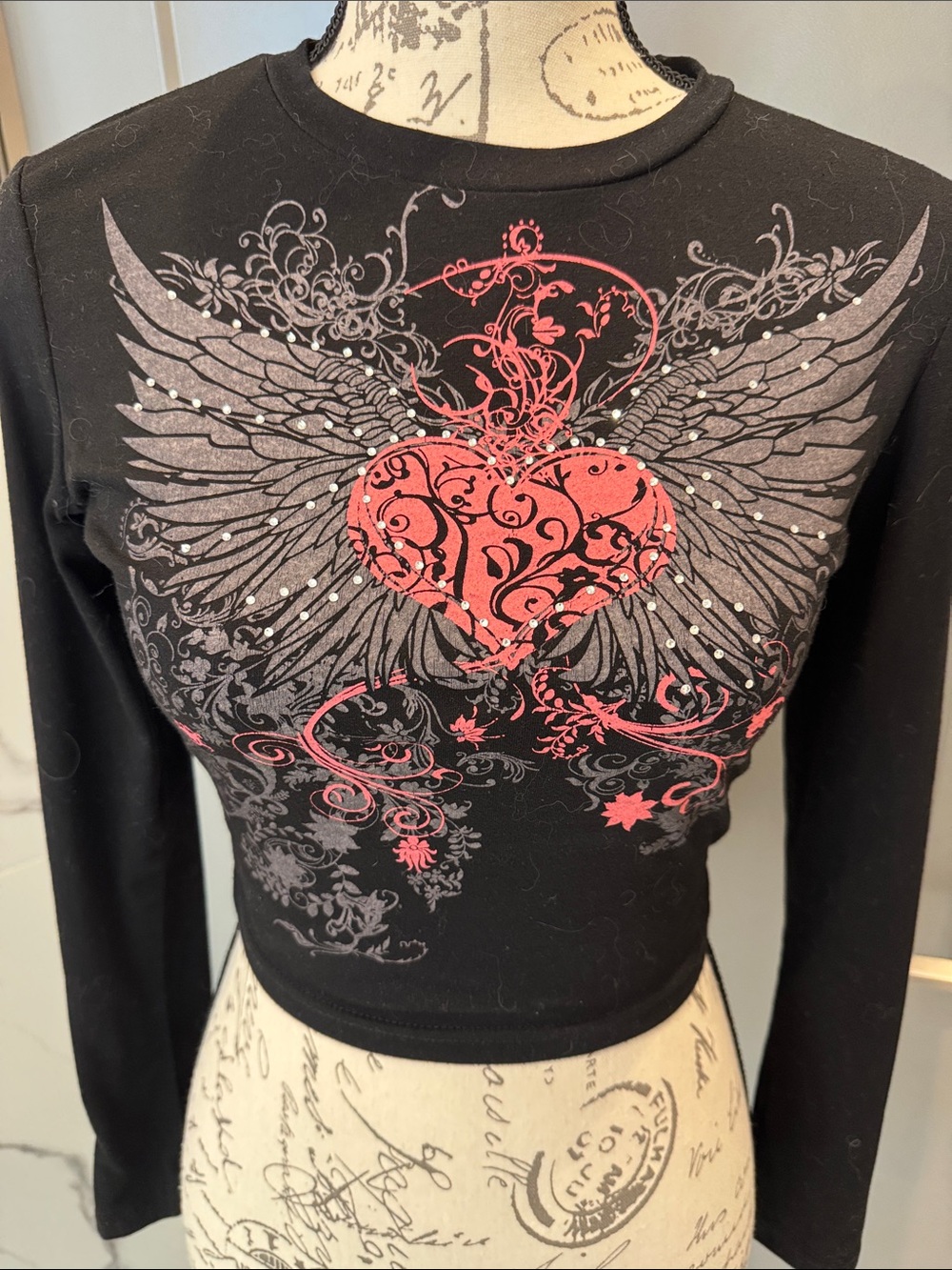Black Long-Sleeve Crop Top with Red Heart Wing Graphic